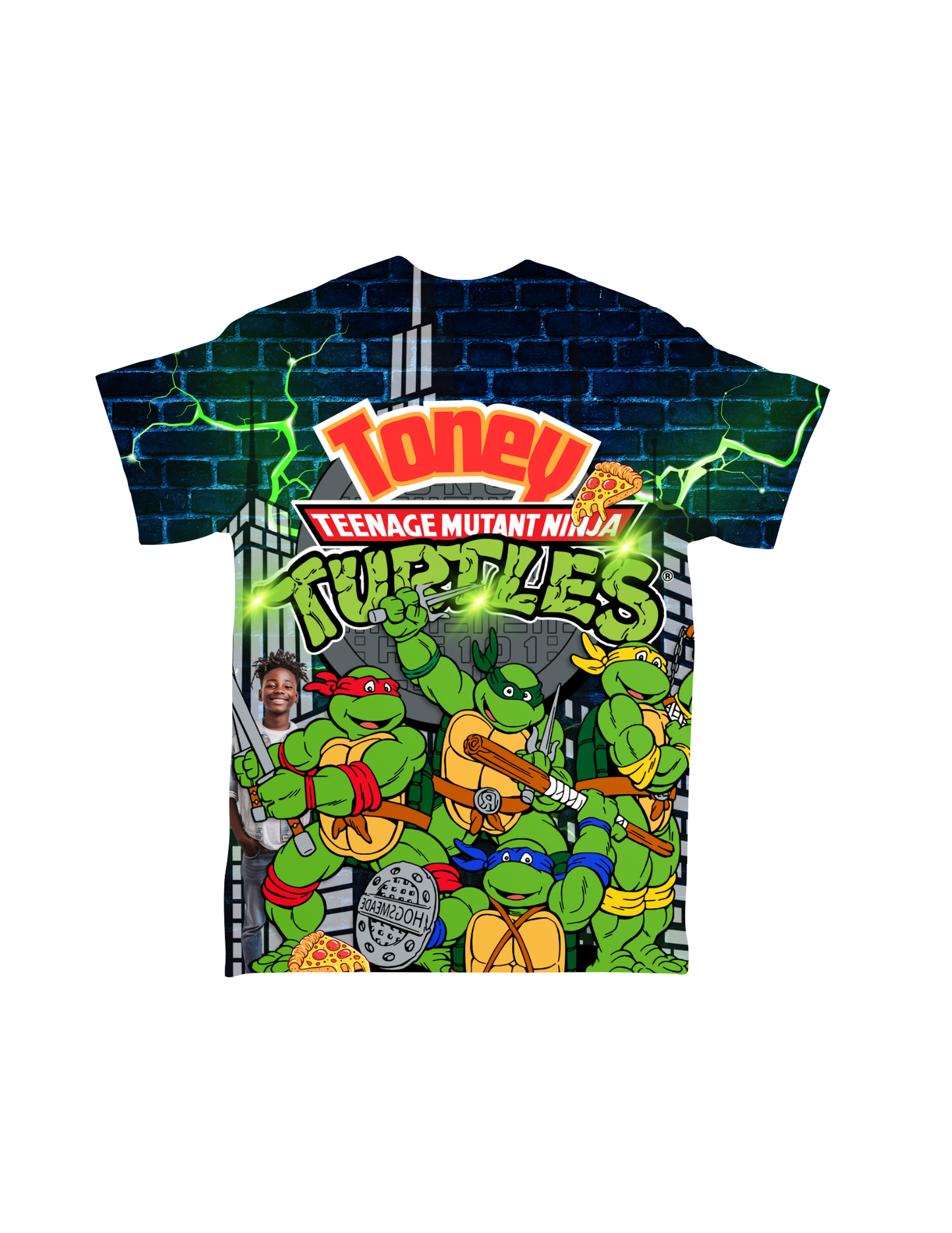 Introducing the Cartoon Character All-Over T-Shirt by Crafty Brown Girl, custom-designed and featuring the Teenage Mutant Ninja Turtles in vibrant colors against a cityscape background. The four turtles, each with their distinct weapons and colored masks, stand ready for action alongside a small, smiling child's face in the design—making it perfect for animation shirt enthusiasts.